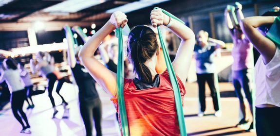 A woman exercising with an exercise band