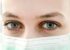 Nurse wearing a mask.